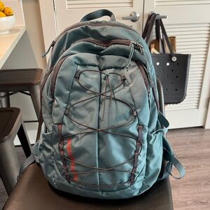 Patagonia Teal Backpack with Red Accents